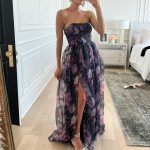 christine andrew trying on floral dress in floor length mirror; fall wedding guest dresses